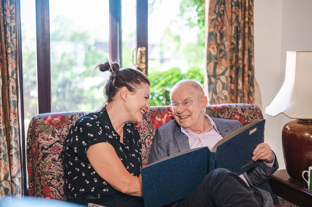 A family member spending time with an elderly relative